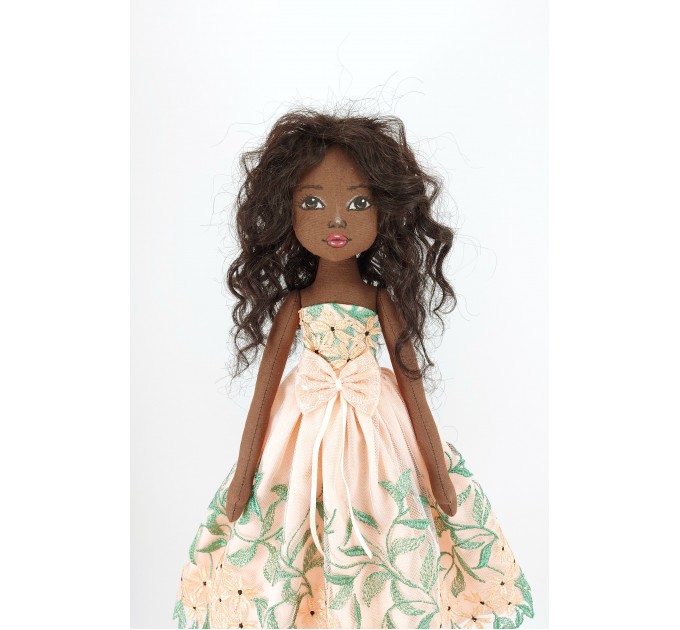 Black Cloth Doll In A Orange Dress