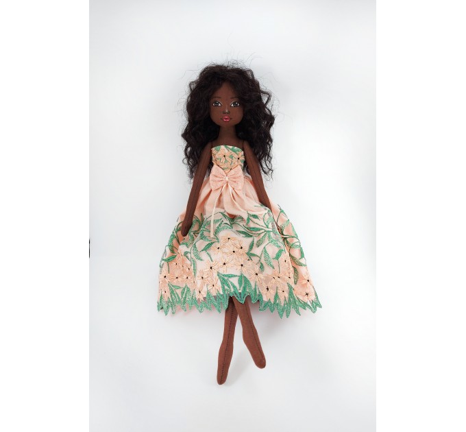 Black Cloth Doll In A Orange Dress