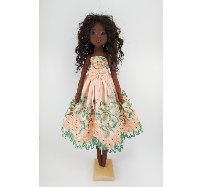 Black Cloth Doll In A Orange Dress