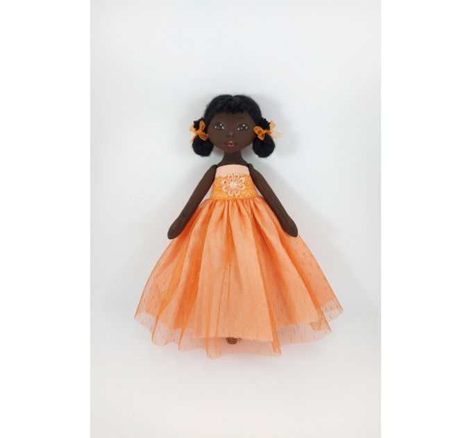 Little Black Rag Doll In An Orange Dress