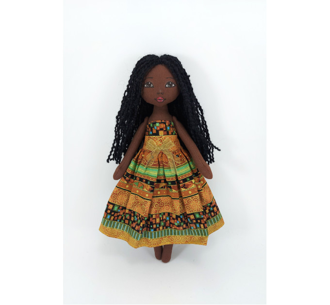 Little Doll Made Of Black Fabric