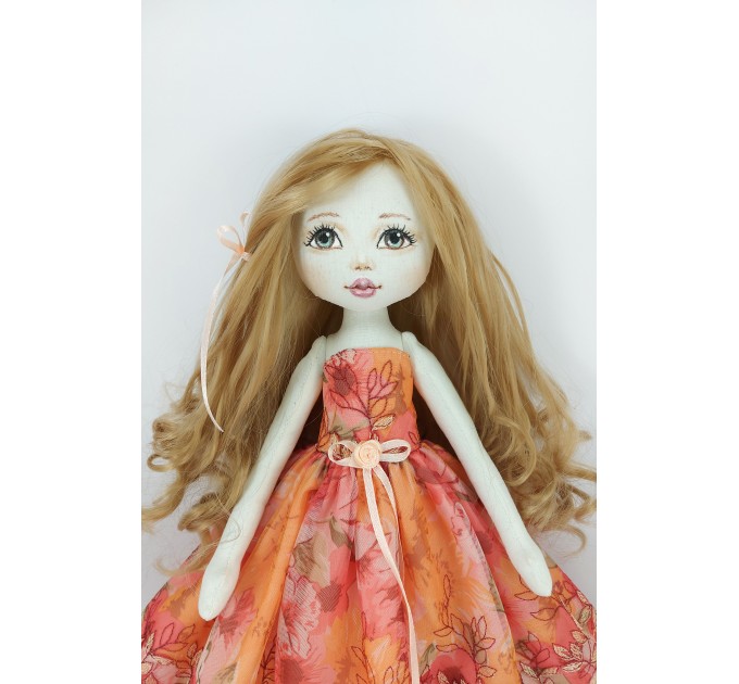 Little Rag Doll In A Orange Dress