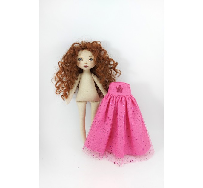 Rag Doll In A Purple Dress With Red Curly Hair